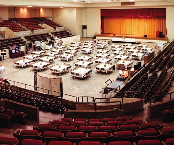 Large Civic Center with many tables and chairs set up
